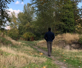 Rob Kajiwara walking on an outdoor path, Fall 2018. Tacoma, Washington